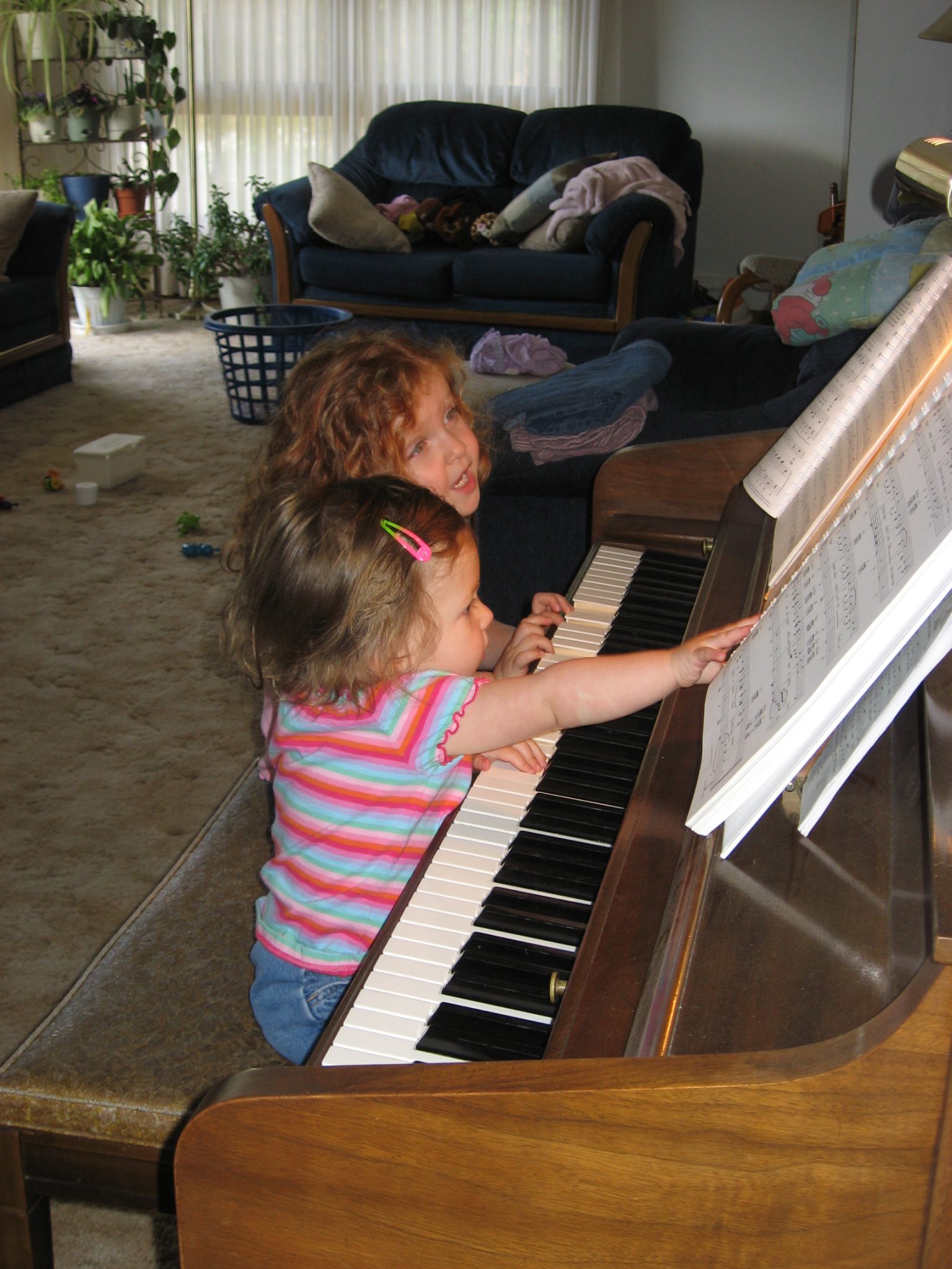 Img 9254 Rachel 14 And Allison 12 Singing And Playing In The Basement Of Their Bismarck Home Img 1294 Rachel 9 And Allison 6 At A Piano Recital Img 0781 Rachel 3 And Allison 16 Months Img 0630 Rachel 3 And Allison 16 Months Bleth Girls